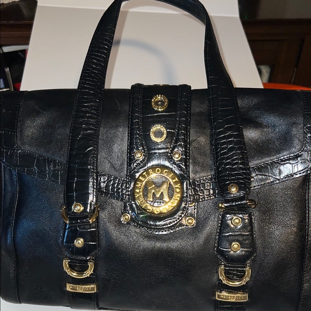 Black Leather MetroCity Handbag with Gold Accents